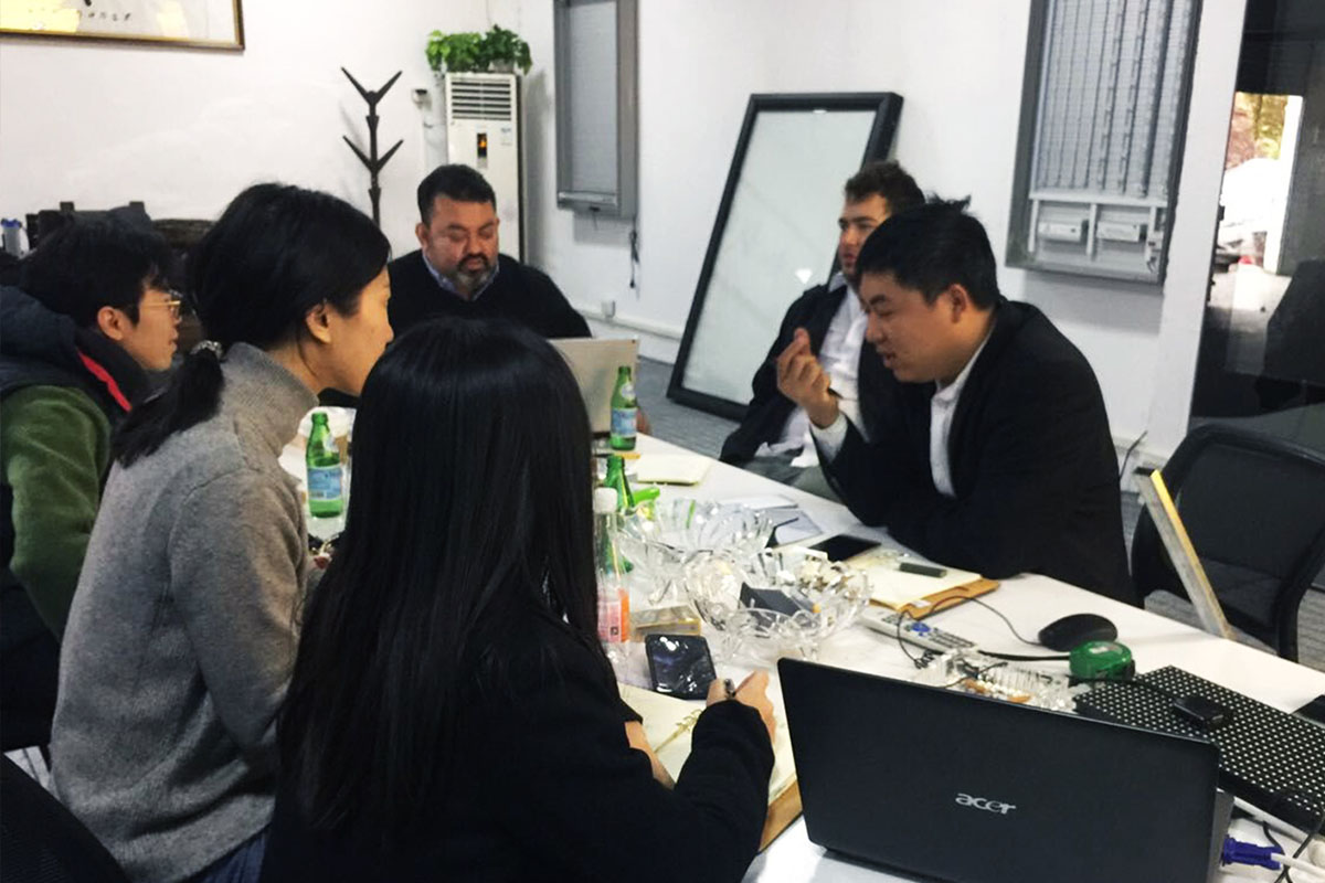 Business representatives discussing large-scale deployment of LCD street signage.