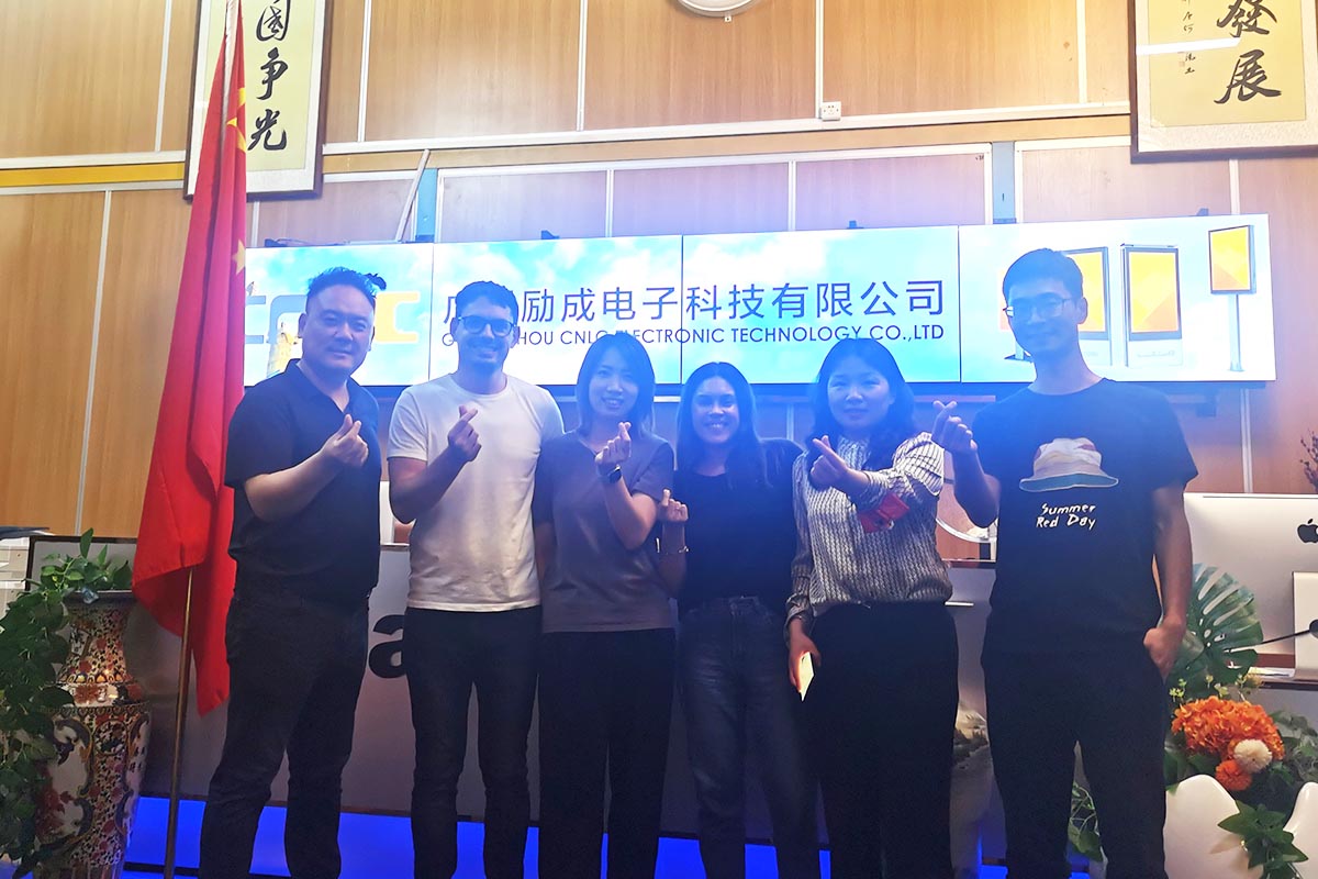 CNLC team celebrating a successful collaboration with international distributors.