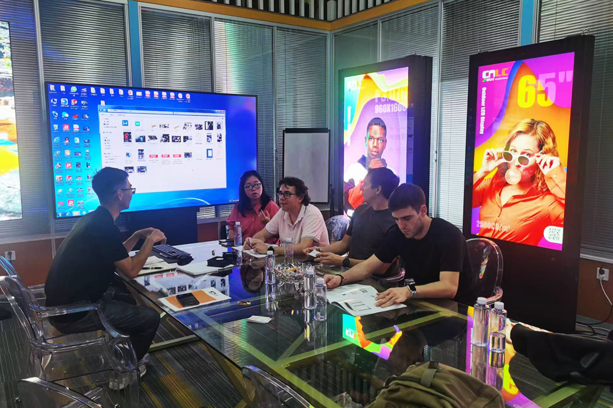 Customers visiting CNLC factory to check high-brightness outdoor LCD signage.