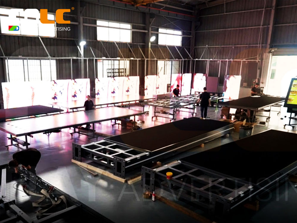 CNLC technicians assembling outdoor LED display modules with precision aluminum structure