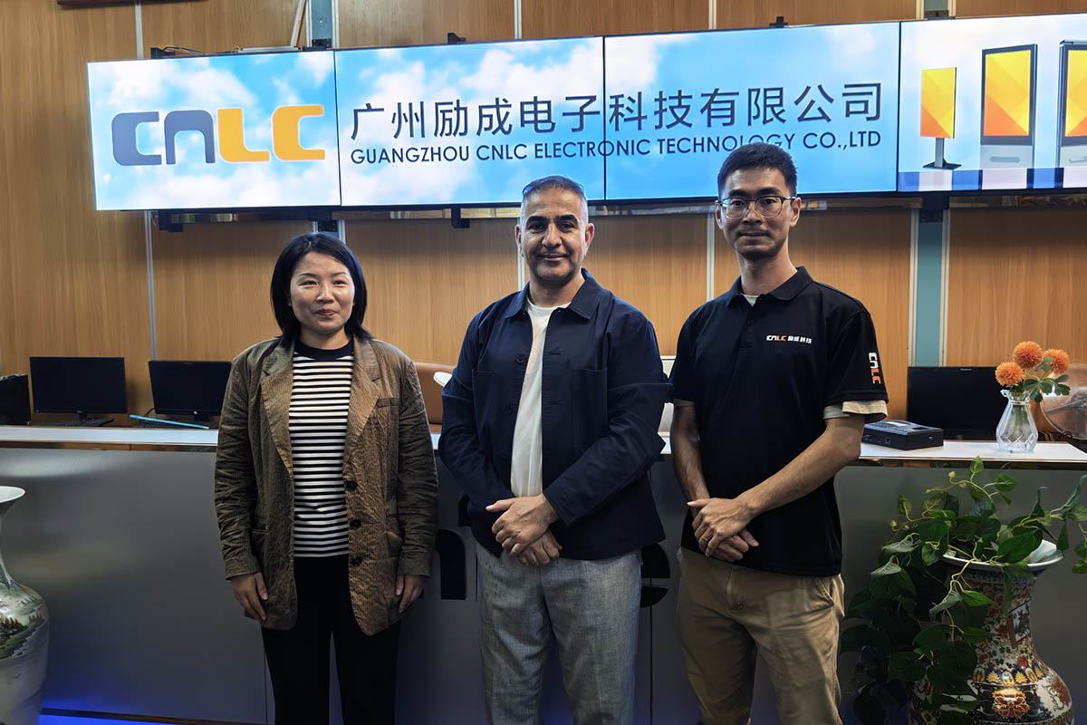 CNLC Display team group photo with clients visiting the outdoor digital signage factory