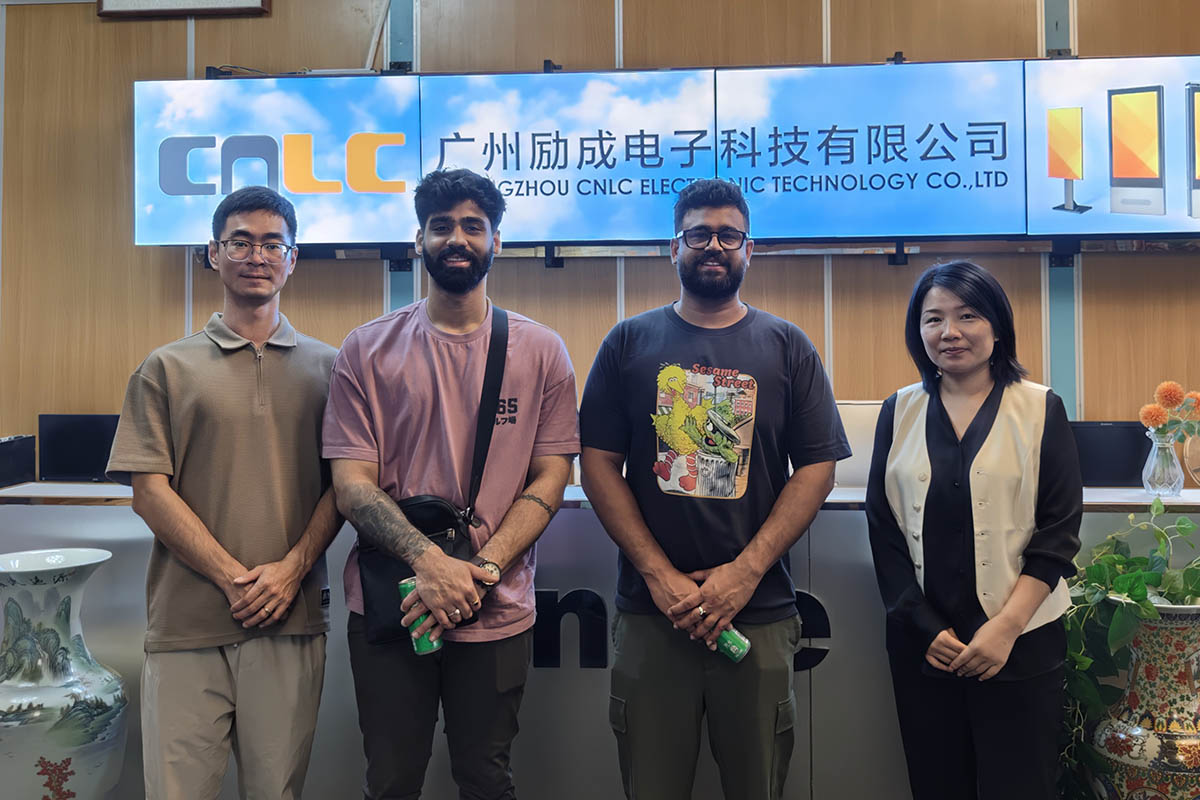 CNLC team taking group photo with overseas clients discussing outdoor display solutions