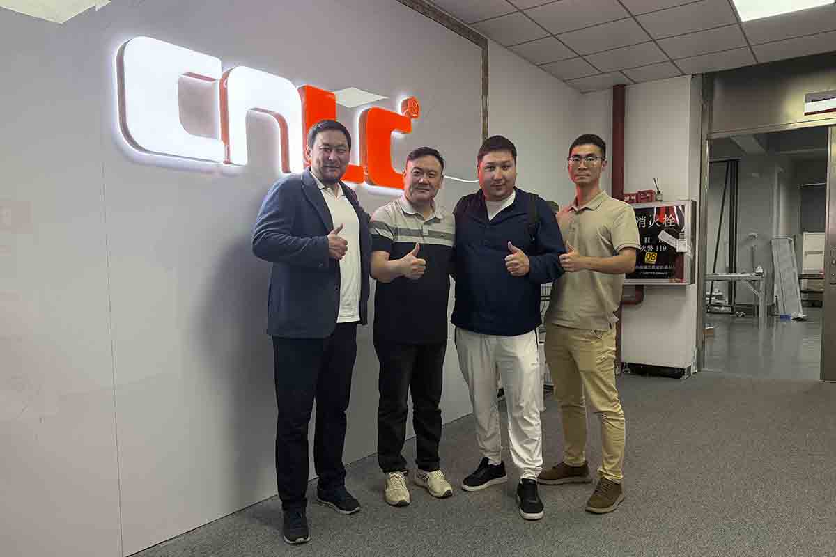 Business partners analyzing interactive touch solutions for retail digital signage.