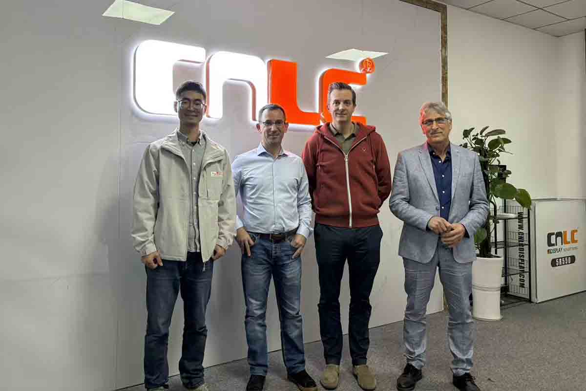 Business executives reviewing high-brightness LCD digital signage for urban projects.